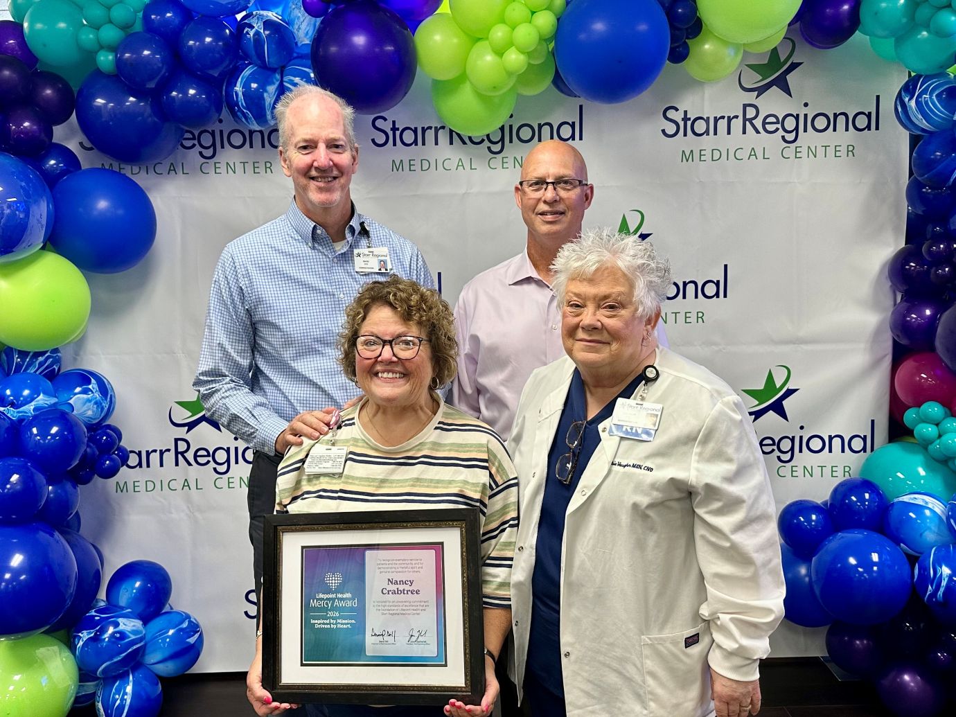 Nancy Crabtree_2026 Mercy Award web Mercy Award winner poses with hospital admin team