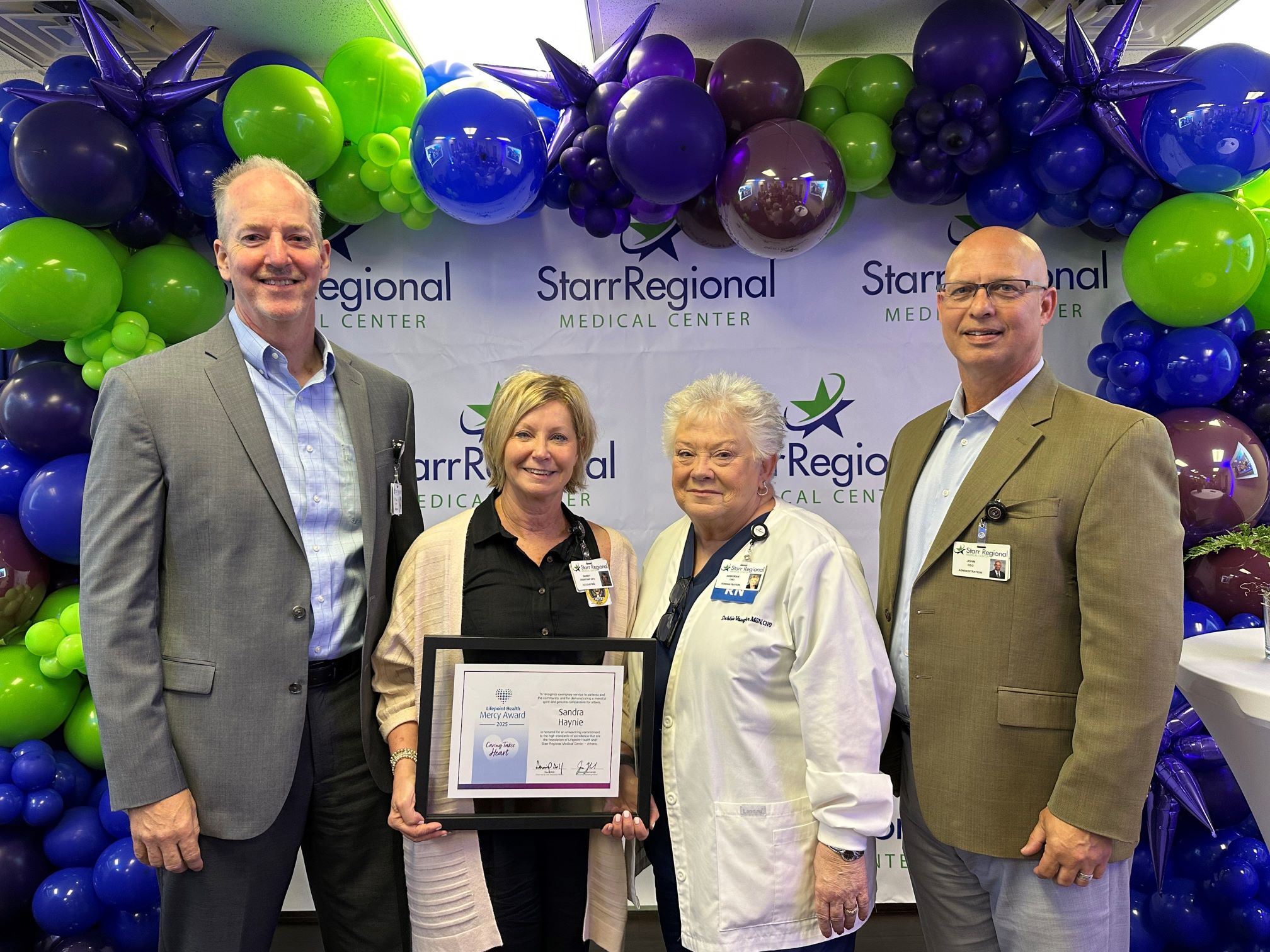 Sandy Haynie pictured with CFO, CNO and CEO of Starr Regional Medical Center