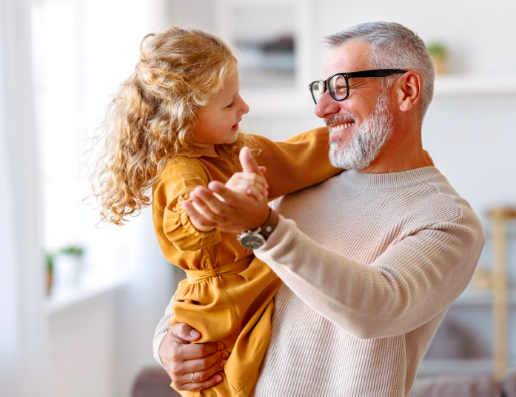 Man holding granddaughter