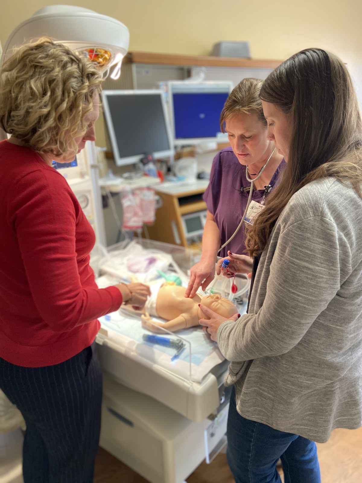 Staff members receive newborn resuscitation training